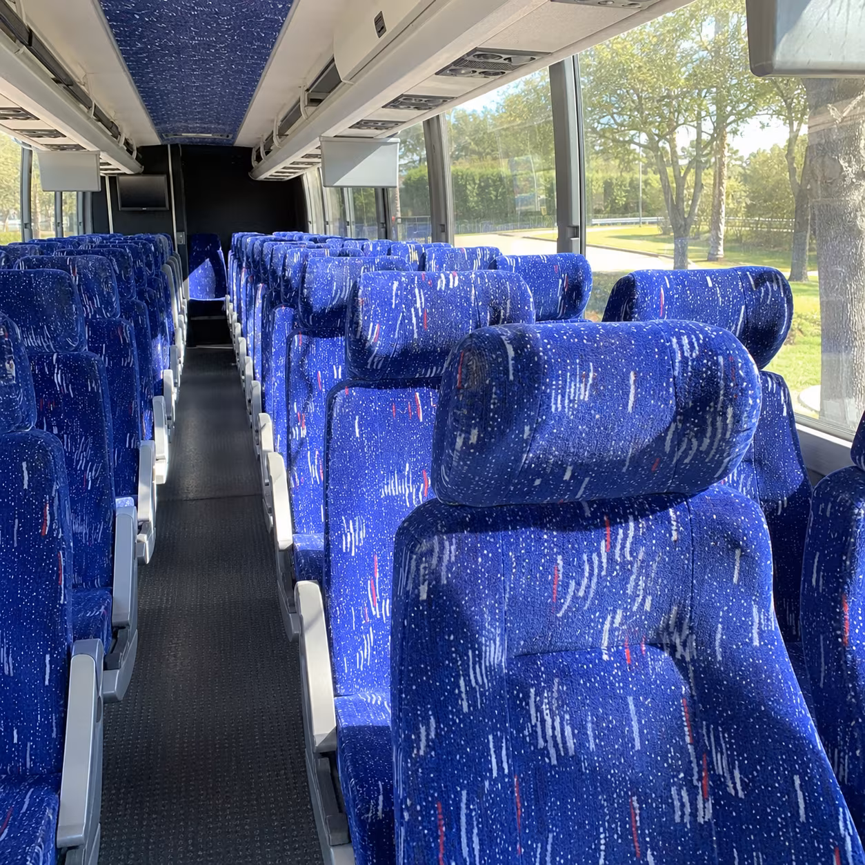 how one way transfers round trips and multi day bookings are priced for bus rentals in springdale arkansas